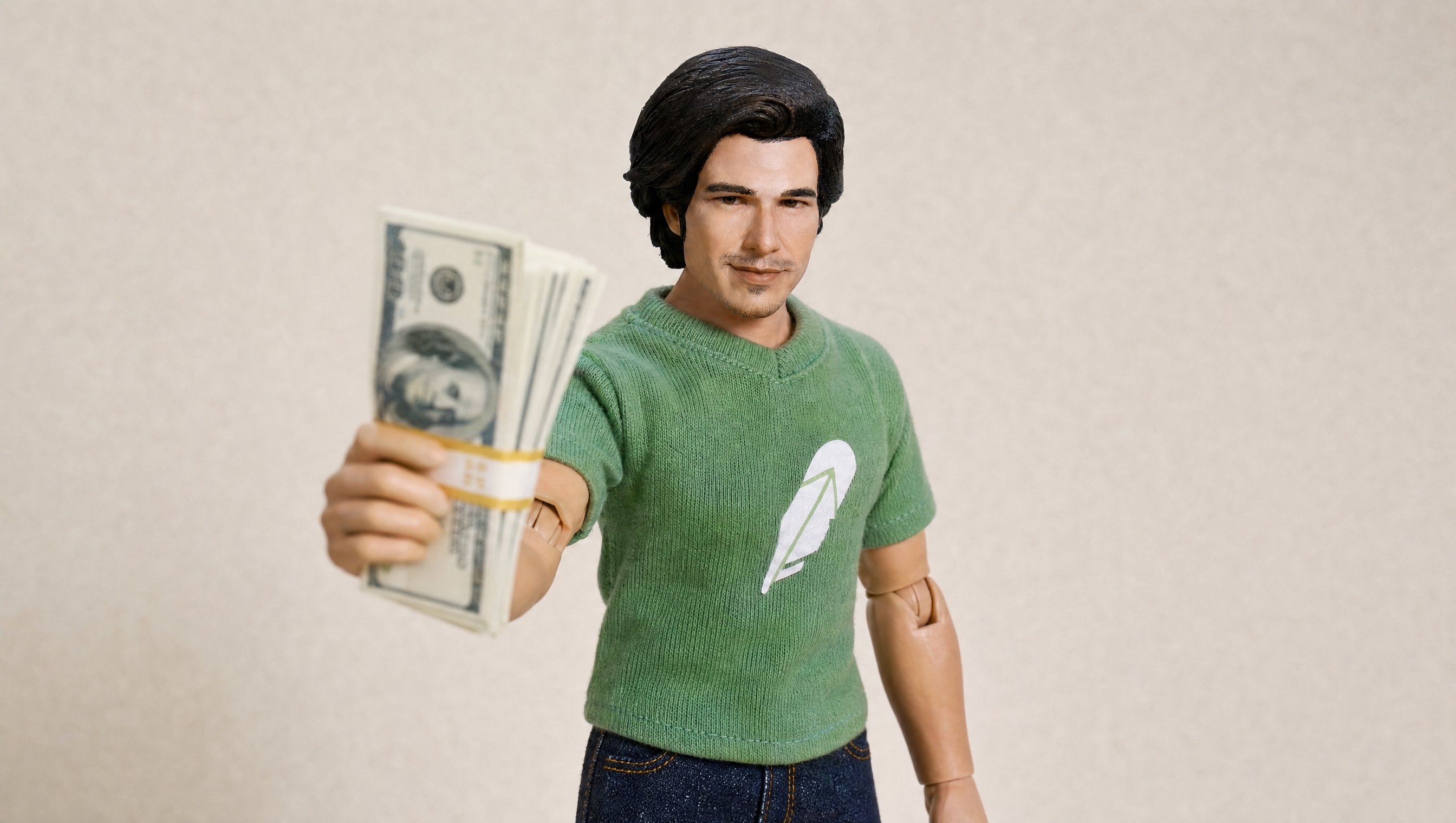 The action figure holding a stack of cash